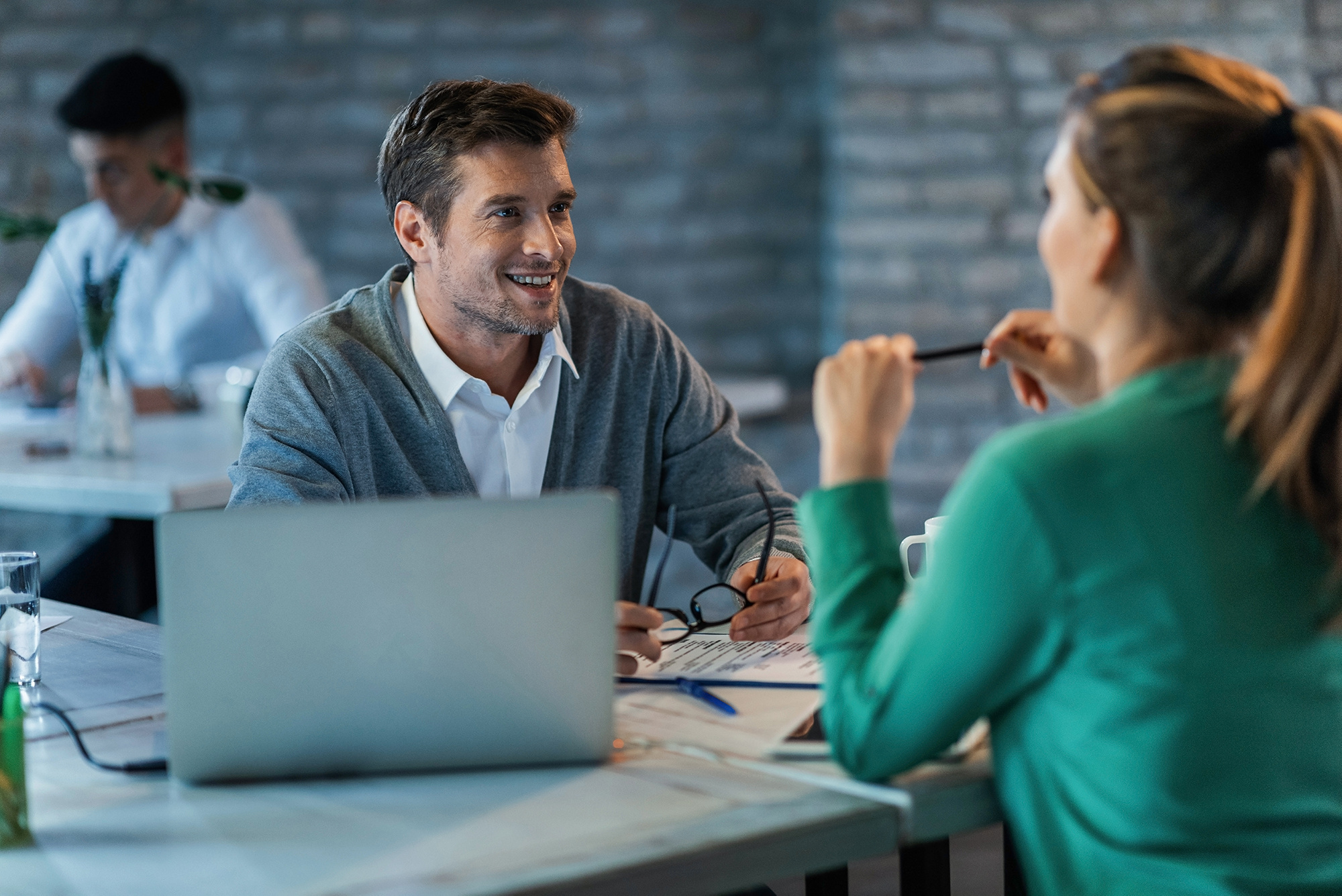 two-entrepreneurs-talking-while-working-desk-office-focus-is-happy-businessman